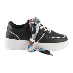 Black women's sneakers tied with a ribbon