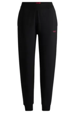 Relaxed-fit tracksuit bottoms with printed logo